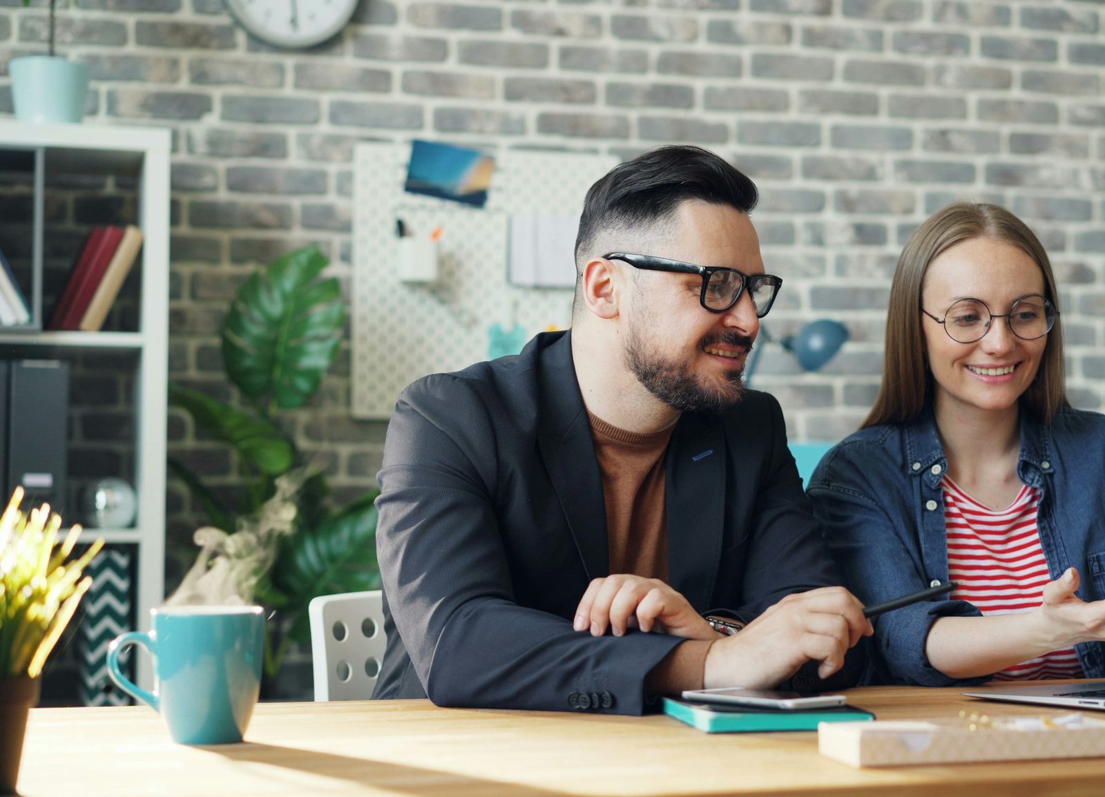 A couple going over plans together at a laptop
